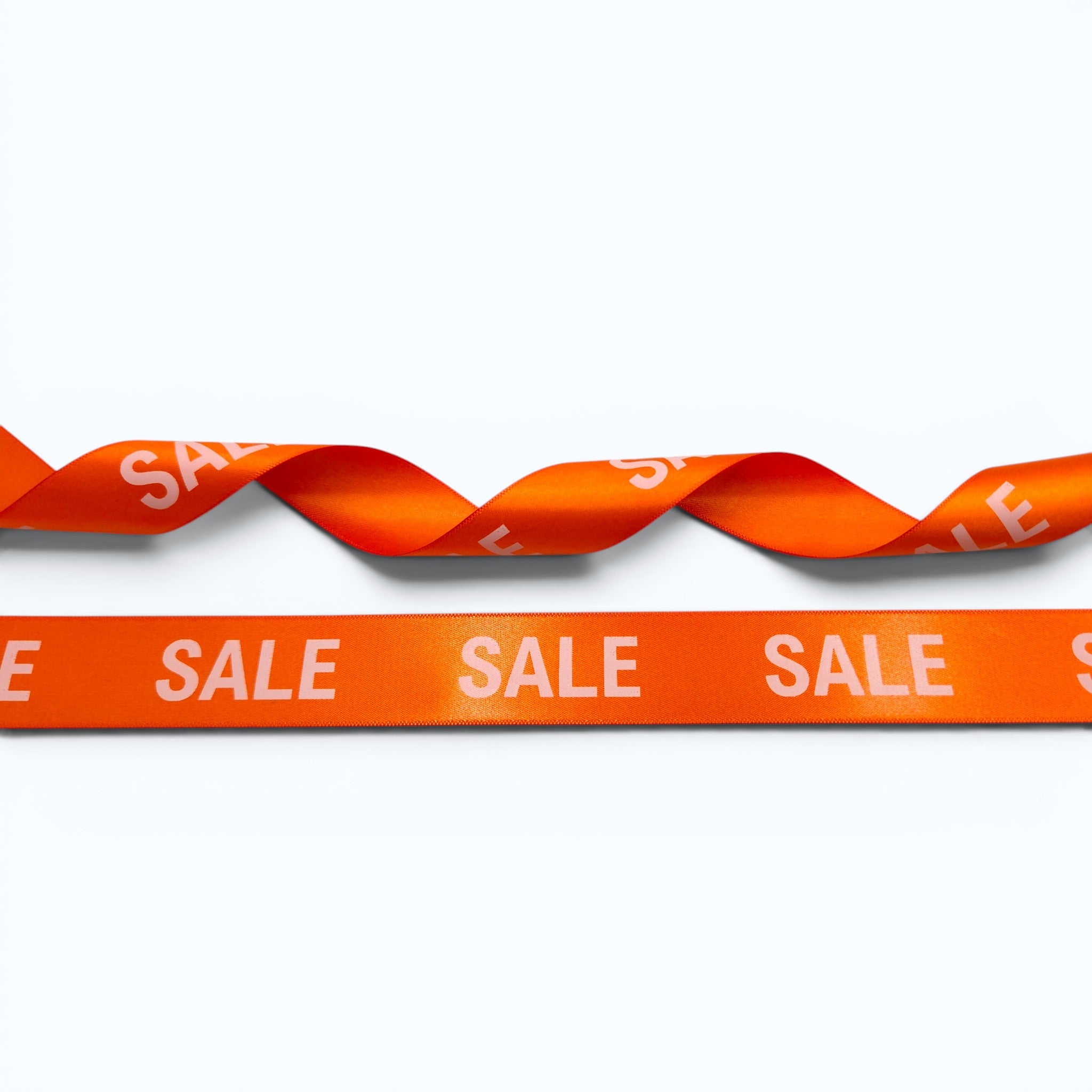 20mm Luxury satin ribbon printed with footballs per 25 meter roll.