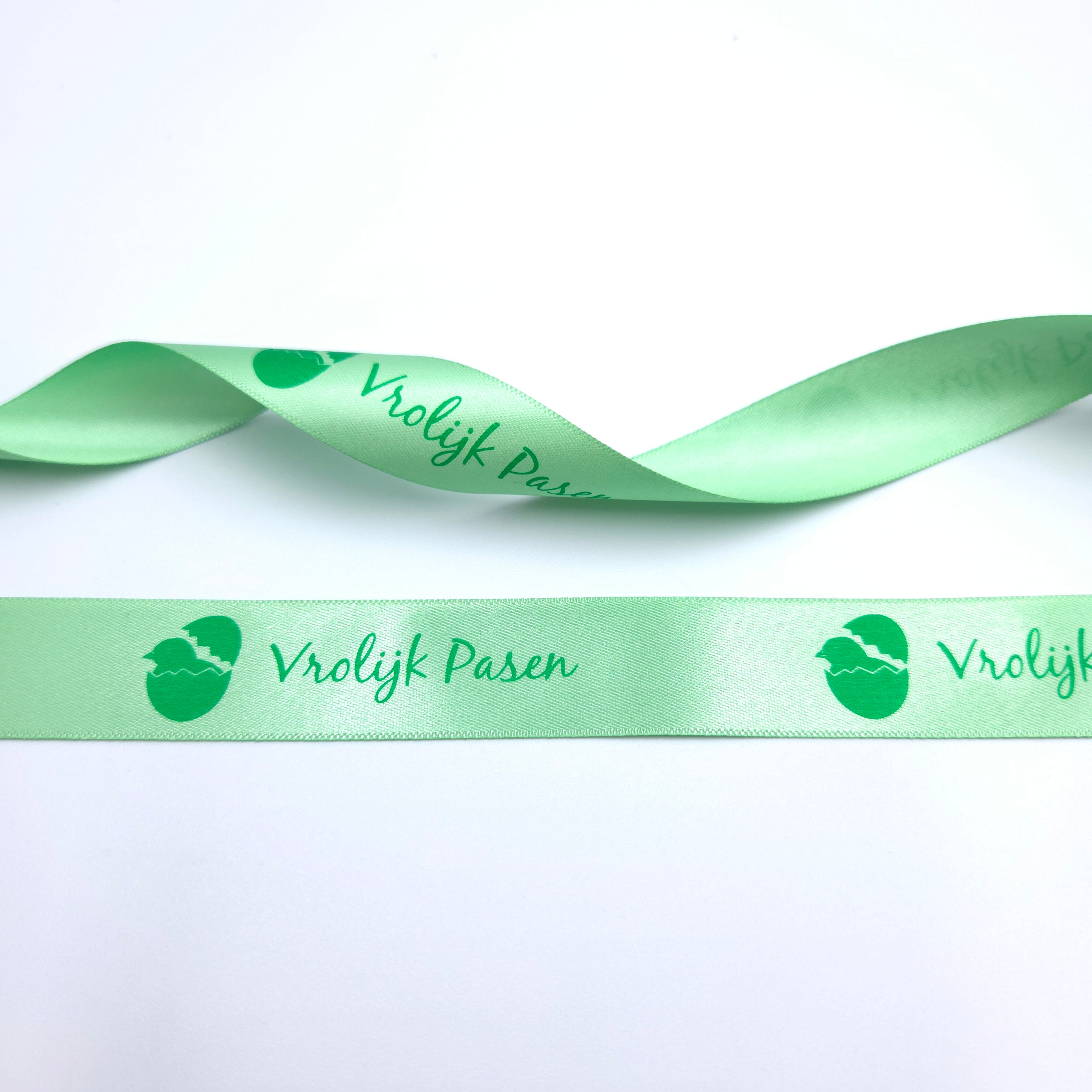 20mm Luxury satin ribbon printed with footballs per 25 meter roll.