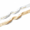 20mm Luxury satin ribbon printed with footballs per 25 meter roll.